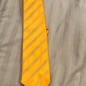 Barney’s tie made in Italy.   Silk  orange